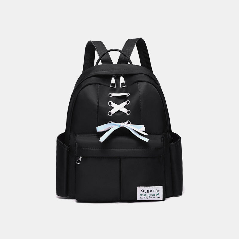 Mochila de nailon para mujer con detalle de lazo: compacta, con varios bolsillos y correas de hombro ajustables