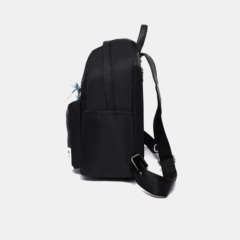 Mochila de nailon para mujer con detalle de lazo: compacta, con varios bolsillos y correas de hombro ajustables