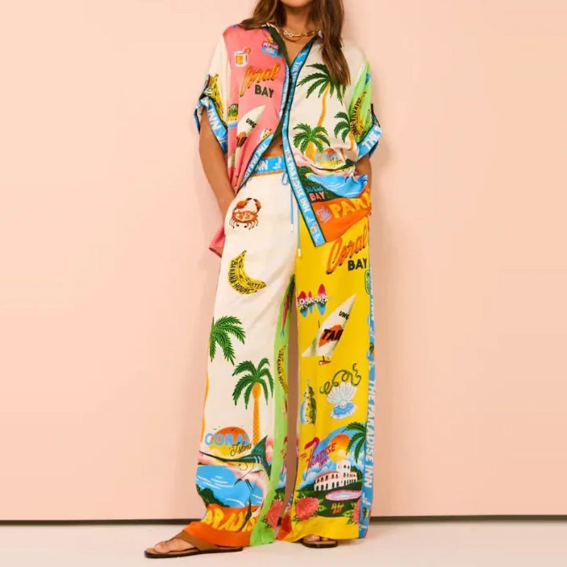Losvallend overhemd met print en knopen en broekset voor dames met wijde pijpen - lichte tweedelige zomeroutfit van satijnmix voor een resort