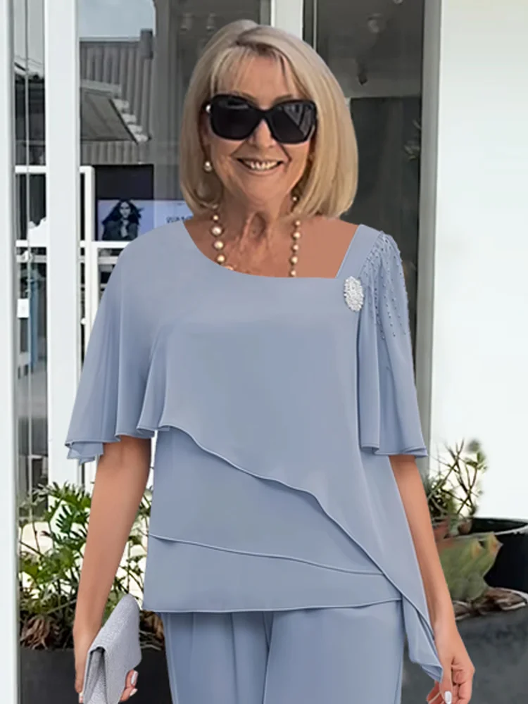 Conjunto feminino de top em camadas e calças de perna larga – visual elegante para a noite
