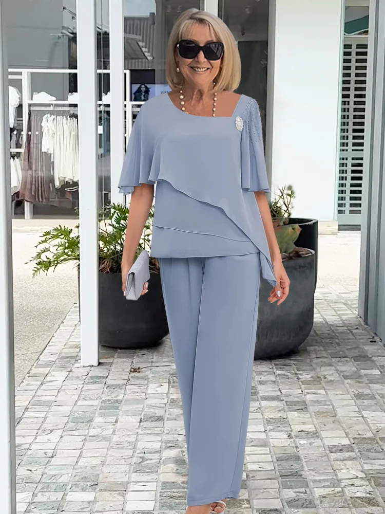 Conjunto feminino de top em camadas e calças de perna larga – visual elegante para a noite