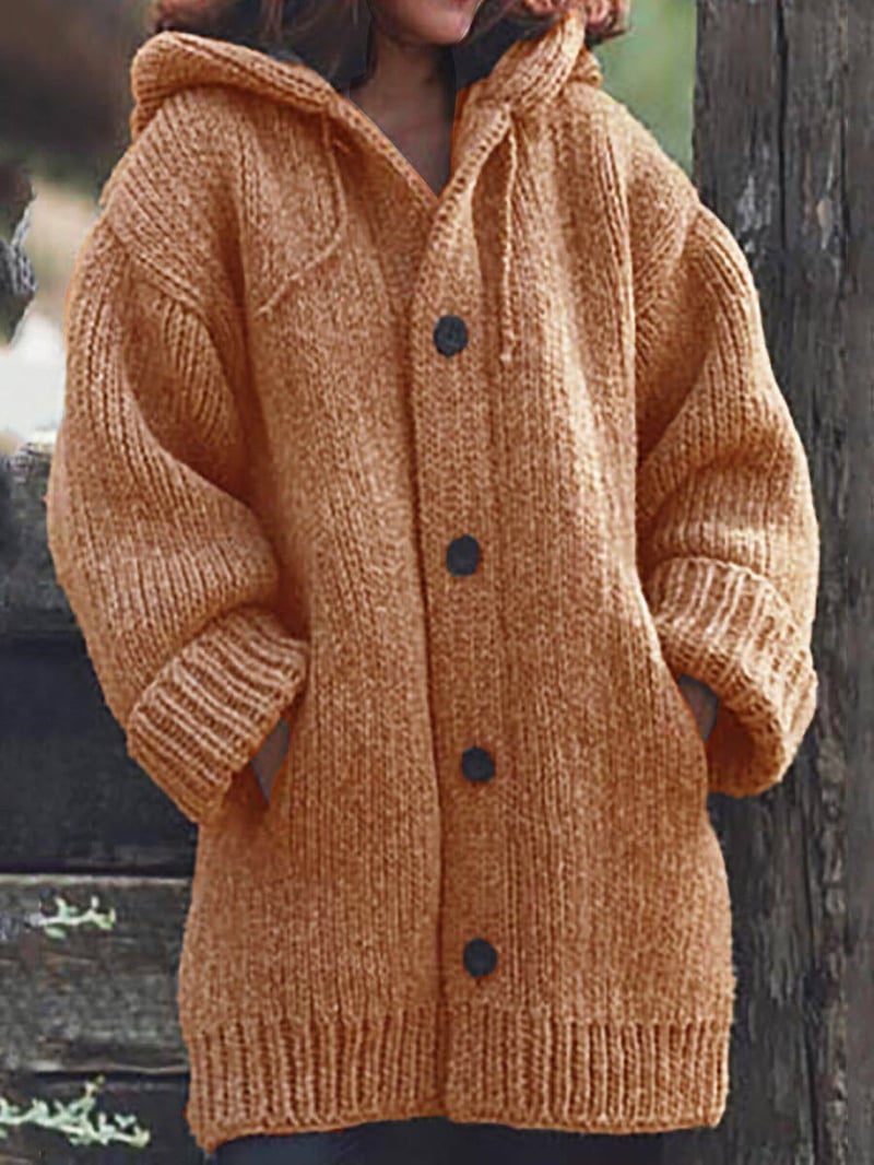 Dámský oversized pletený kardigan s kapucí - objemný dlouhý model na knoflíky s kapsami pro ležérní podzimní a zimní každodenní nošení