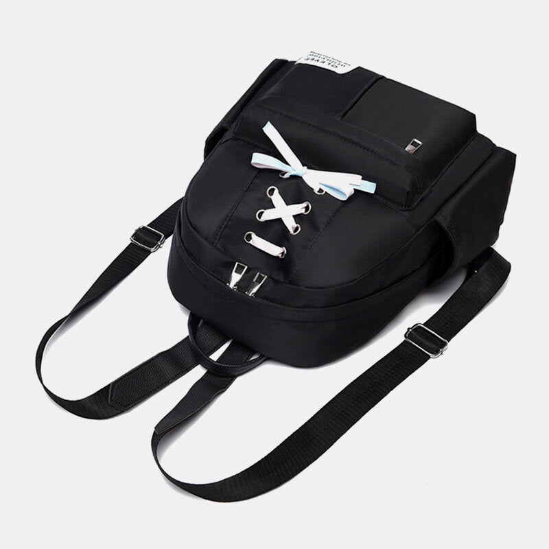 Mochila de nailon para mujer con detalle de lazo: compacta, con varios bolsillos y correas de hombro ajustables