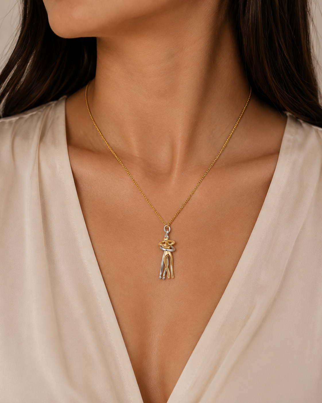 Women’s Embrace Pendant Necklace – Two-Tone Polished Metal Chain with Hugging Figure Charm for Everyday Wear and Meaningful Gifting