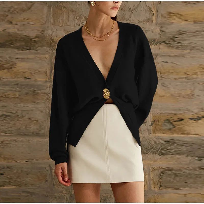 Kort damesvest van breisel met V-hals en opvallende knoop - losvallend model met ballonmouwen voor nette casual outfits