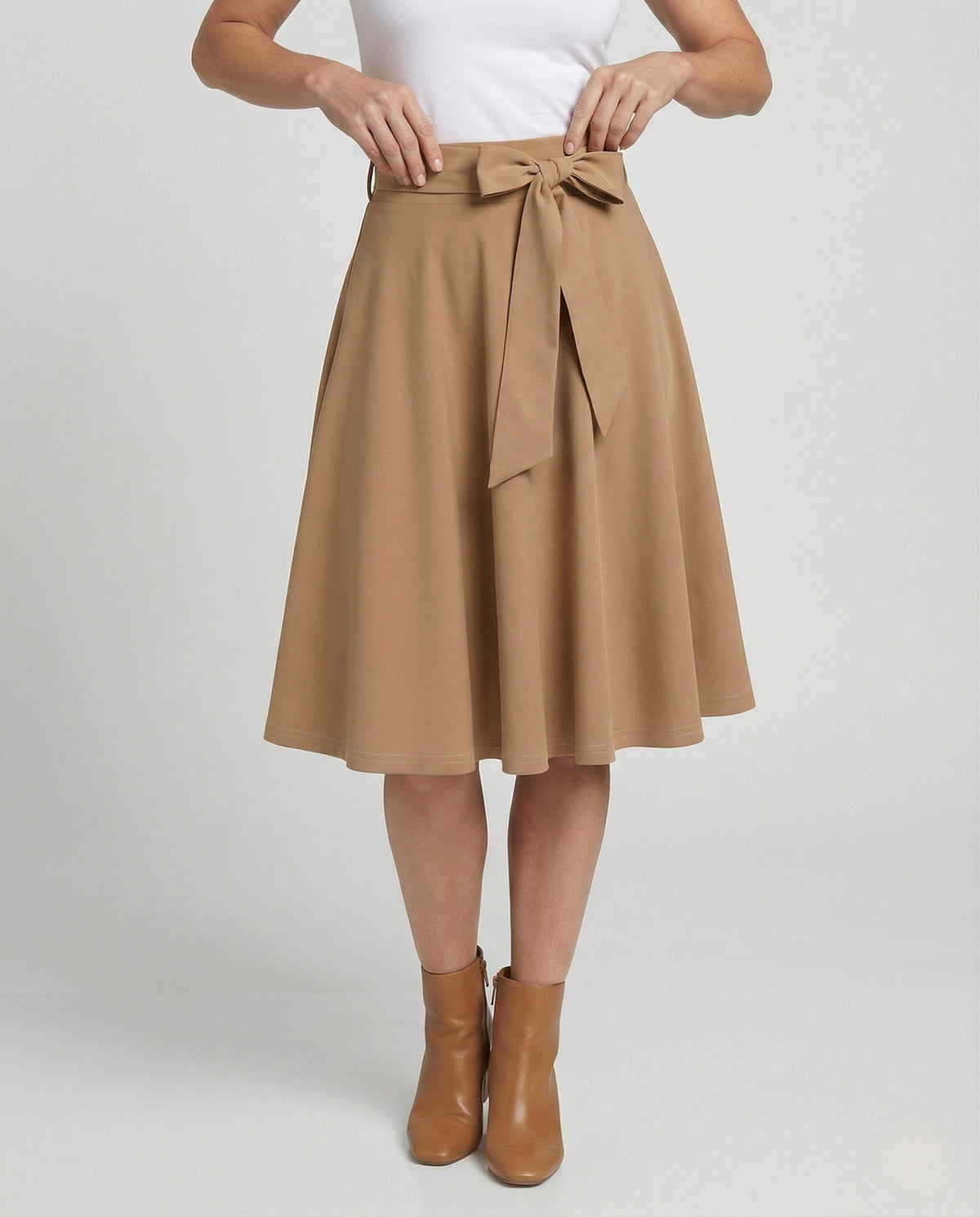 A-lijnrok met hoge taille voor dames – elegante uitlopende knielange rok met strikceintuur voor een nette, casual look