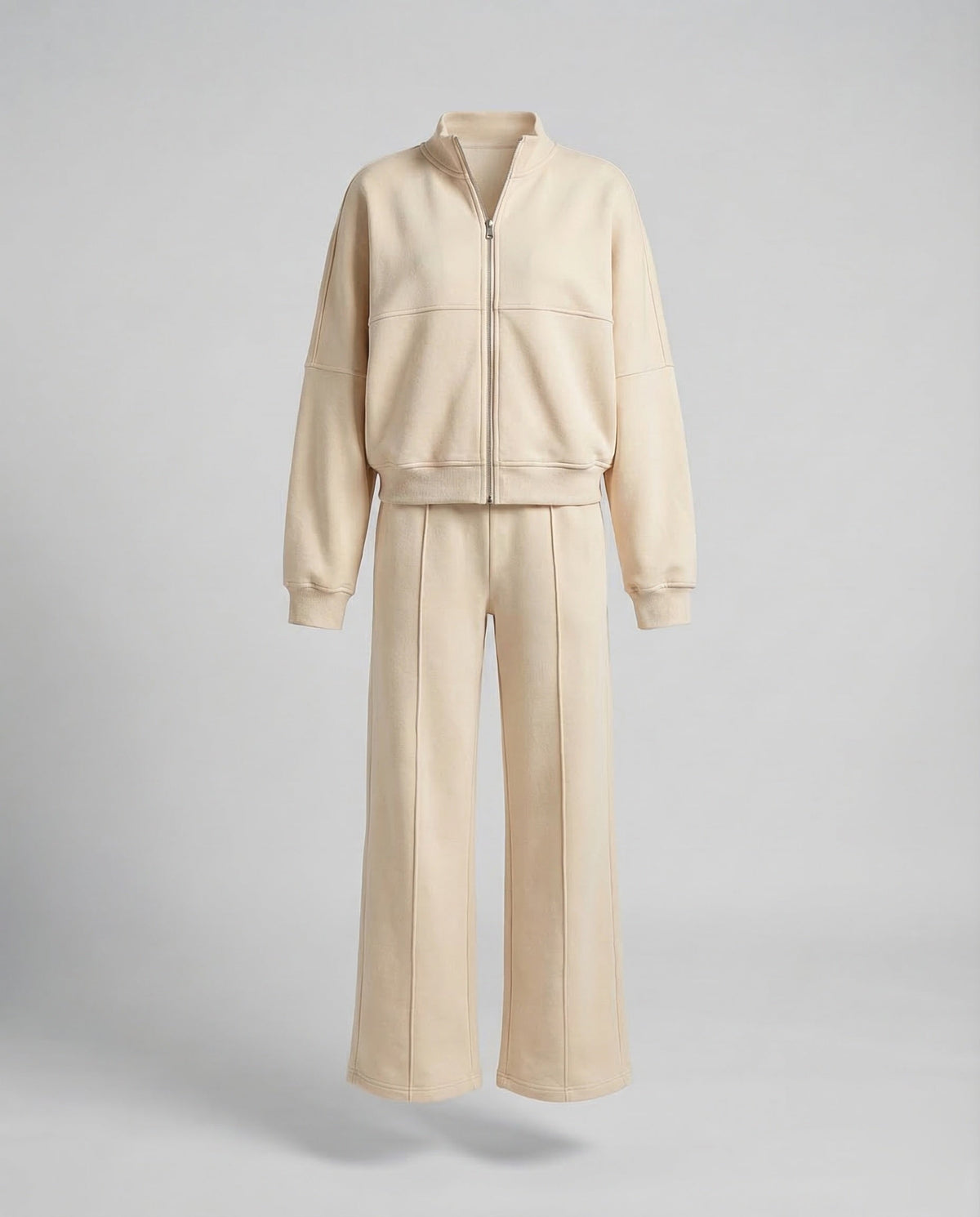 Completo sportivo da donna a due pezzi con giacca corta con zip e pantaloni ampi – Outfit coordinato dal taglio morbido, ideale per viaggi e momenti di relax nel weekend