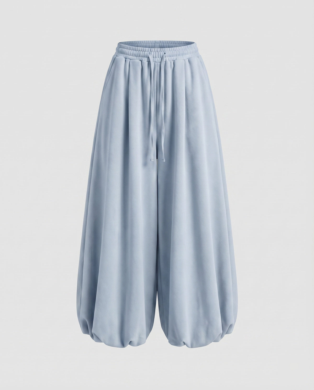 Calças jogger largas estilo balão para mulher – modelo de cintura subida com pernas largas, cintura com cordão e bainhas franzidas, para um estilo urbano casual