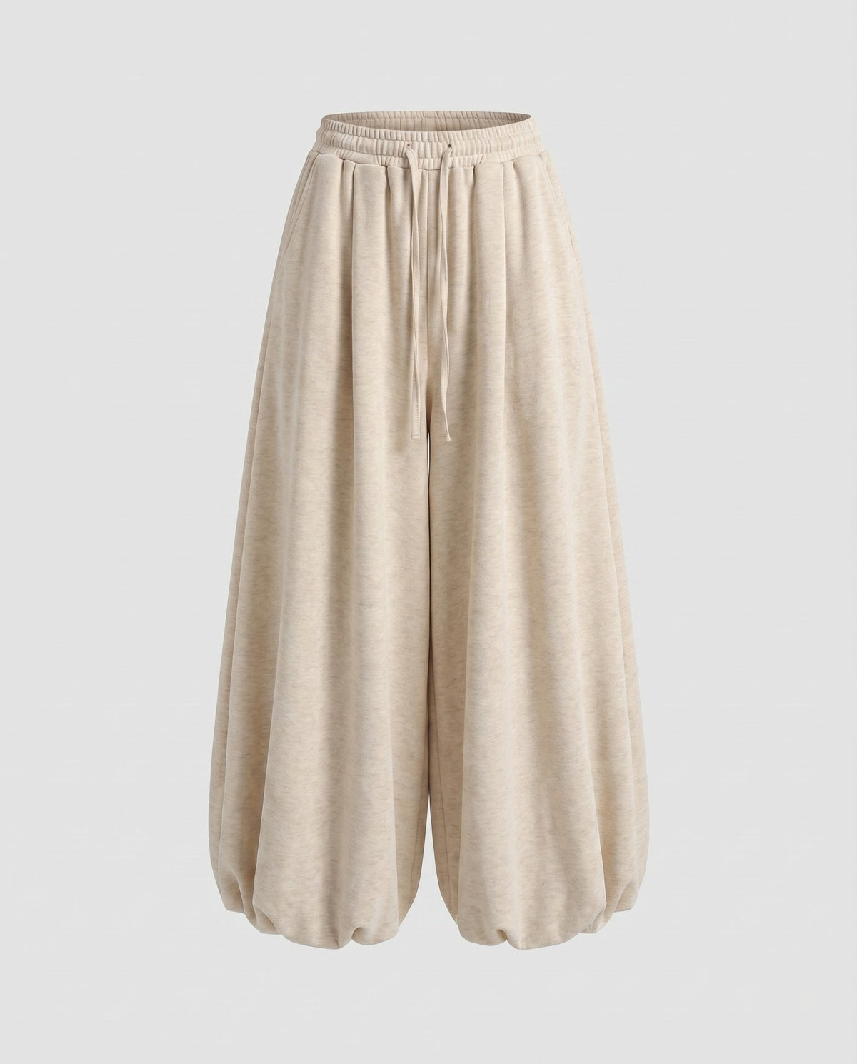 Calças jogger largas estilo balão para mulher – modelo de cintura subida com pernas largas, cintura com cordão e bainhas franzidas, para um estilo urbano casual