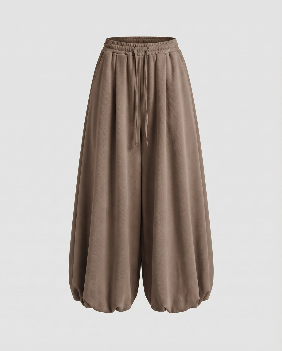 Calças jogger largas estilo balão para mulher – modelo de cintura subida com pernas largas, cintura com cordão e bainhas franzidas, para um estilo urbano casual