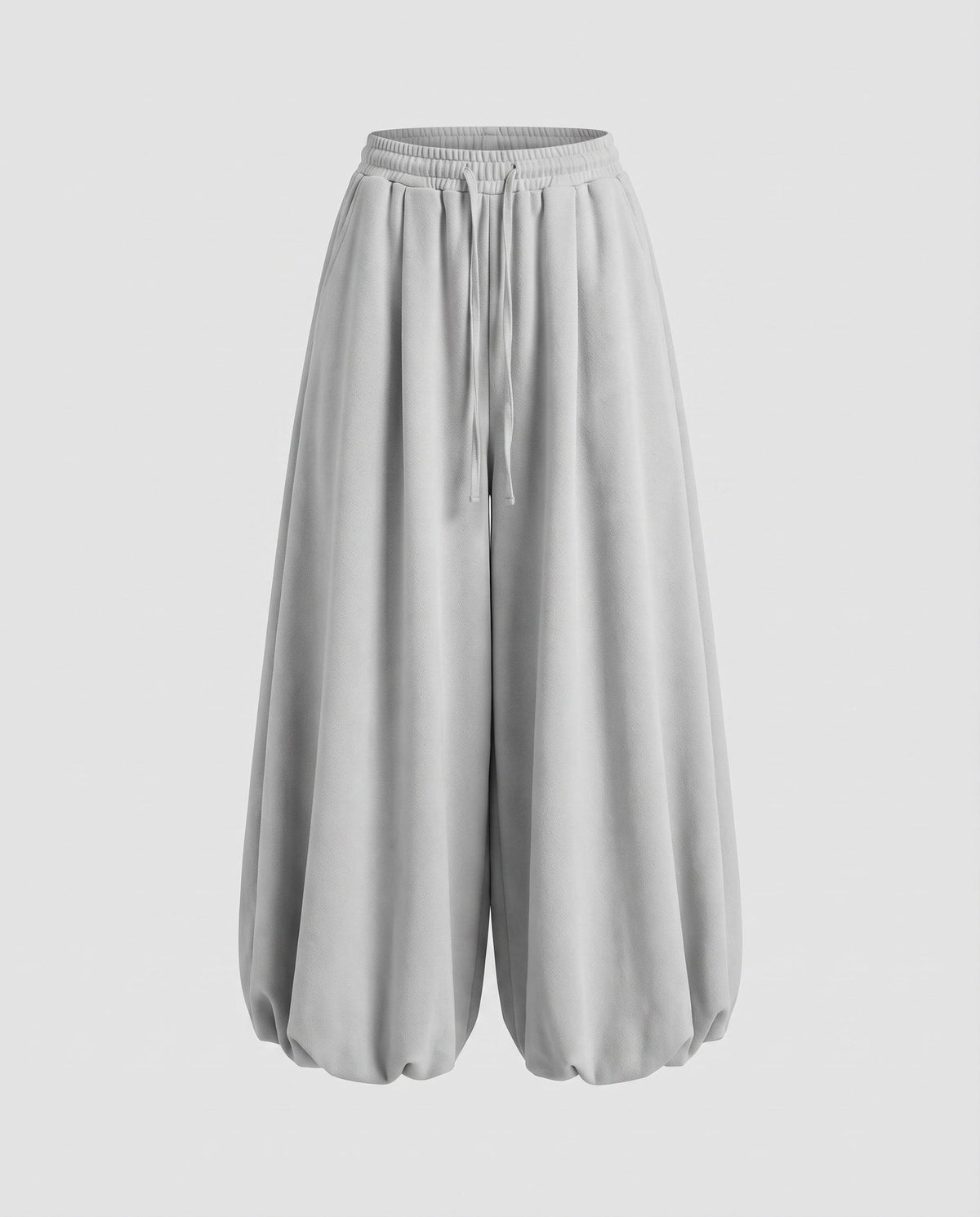 Calças jogger largas estilo balão para mulher – modelo de cintura subida com pernas largas, cintura com cordão e bainhas franzidas, para um estilo urbano casual