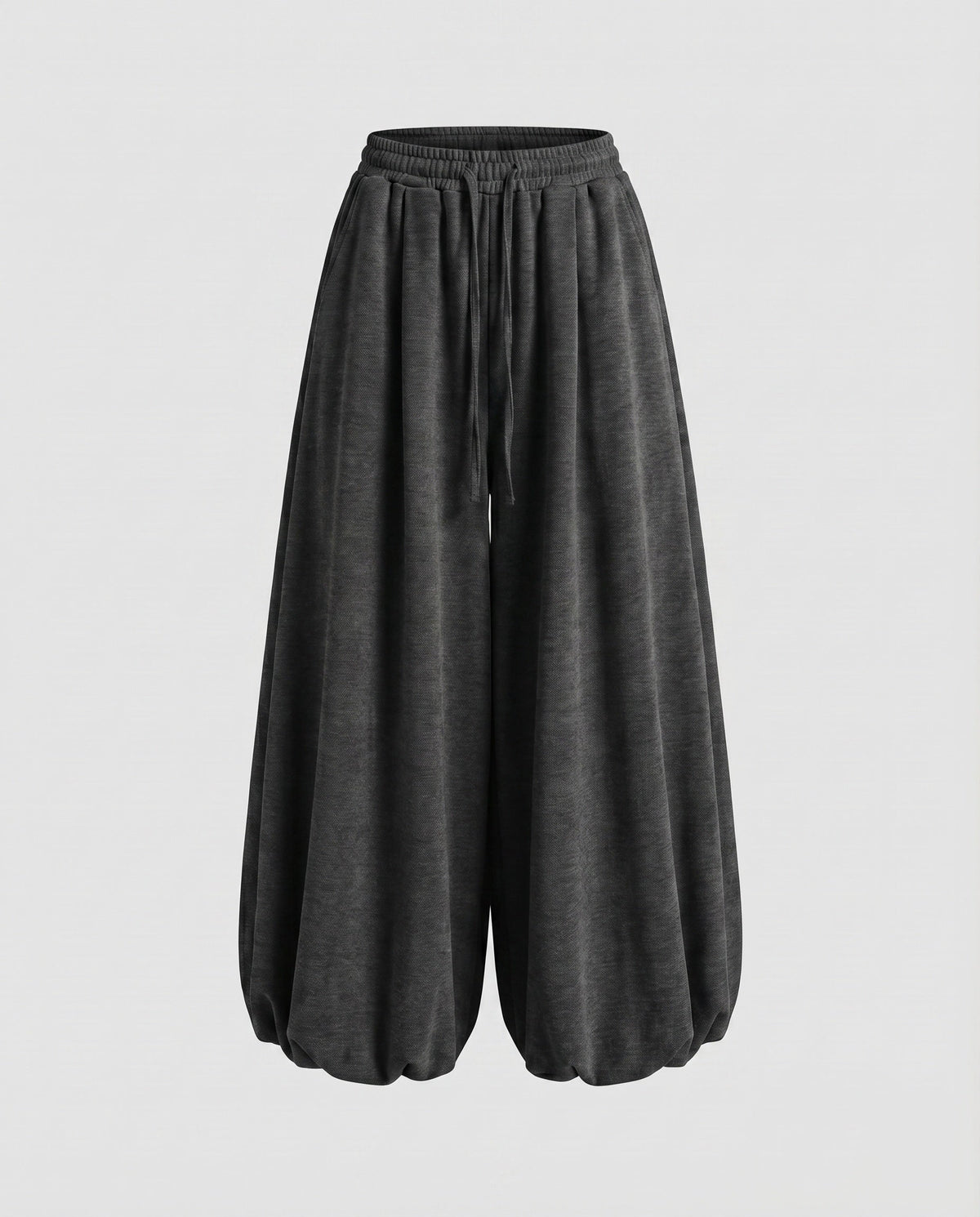 Calças jogger largas estilo balão para mulher – modelo de cintura subida com pernas largas, cintura com cordão e bainhas franzidas, para um estilo urbano casual