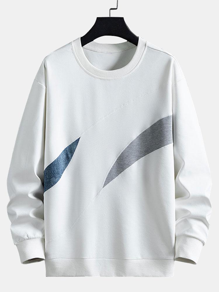 Afslappet sweatshirt til mænd med abstrakte farveblokke, rund hals og buede kontrastpaneler – langærmet fritidstrøje i streetwear-stil til hverdagsbrug