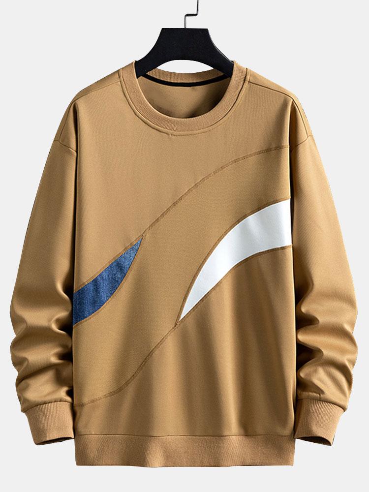 Afslappet sweatshirt til mænd med abstrakte farveblokke, rund hals og buede kontrastpaneler – langærmet fritidstrøje i streetwear-stil til hverdagsbrug