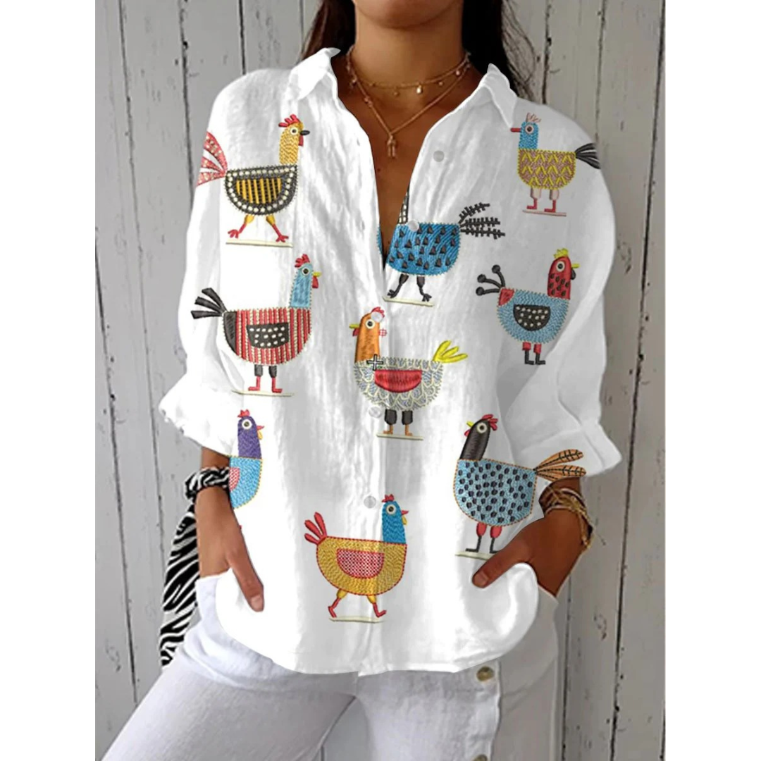 Damenbluse med finurligt print – løstsiddende top med krave til weekend- og rejtestyling