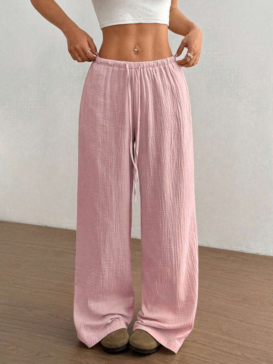 Pantaloni larghi da donna con vita regolabile e tessuto strutturato