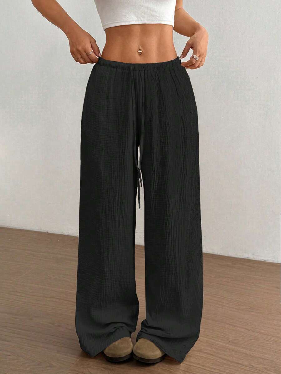 Pantaloni larghi da donna con vita regolabile e tessuto strutturato