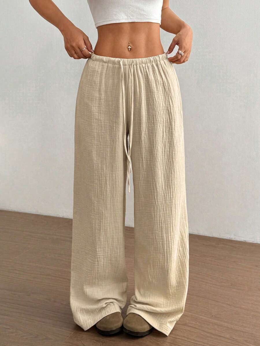 Pantaloni larghi da donna con vita regolabile e tessuto strutturato