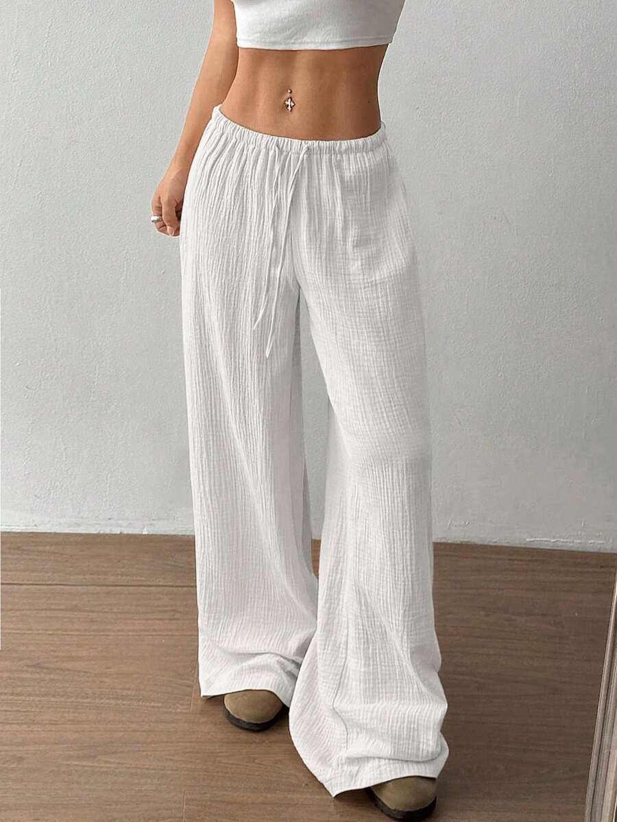 Pantaloni larghi da donna con vita regolabile e tessuto strutturato